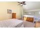 Bright bedroom with loft and vaulted ceilings featuring a queen bed, and wood furniture at 3700 Golf Colony Lane # 21 B, Little River, SC 29566