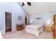 Comfortable bedroom with queen bed, soft blue walls, and a fan for ideal temperature control at 3700 Golf Colony Lane # 21 B, Little River, SC 29566