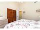 Neutral bedroom featuring a queen size bed and closet space, ideal for a relaxing retreat at 3700 Golf Colony Lane # 21 B, Little River, SC 29566