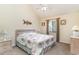 Cozy bedroom with a queen size bed, coastal themed decor, and a window for natural light at 3700 Golf Colony Lane # 21 B, Little River, SC 29566