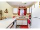 Functional kitchen featuring a white countertop, ample cabinet storage, and a stainless steel sink at 3700 Golf Colony Lane # 21 B, Little River, SC 29566