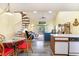 Open floor plan showcasing a kitchen, dining area, and living space with a spiral staircase at 3700 Golf Colony Lane # 21 B, Little River, SC 29566