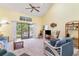 Bright living room with vaulted ceilings, balcony access, and comfortable seating at 3700 Golf Colony Lane # 21 B, Little River, SC 29566