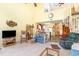 Bright living room featuring vaulted ceilings, a spiral staircase, and an open floor plan at 3700 Golf Colony Lane # 21 B, Little River, SC 29566
