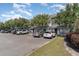 Well-maintained parking lot surrounded by trees and manicured landscaping at 3700 Golf Colony Lane # 21 B, Little River, SC 29566