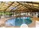 Relaxing indoor pool area with ample seating and a bright, airy atmosphere with nice lighting at 3700 Golf Colony Lane # 21 B, Little River, SC 29566
