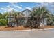 Lovely community indoor pool building with palm trees and mature landscaping at 3700 Golf Colony Lane # 21 B, Little River, SC 29566
