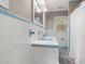 Vintage bathroom showcasing charming blue and white tile, double vanity, and ample natural light at 3934 North Fraser St., Georgetown, SC 29440