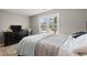 Bright bedroom offering wood-look floors, neutral tones, and lots of natural light from the windows at 3934 North Fraser St., Georgetown, SC 29440