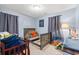 Welcoming bedroom with wood-look flooring, comfortable bed, and lots of space to play at 3934 North Fraser St., Georgetown, SC 29440