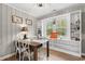 Cozy dining room with a wooden table, built-in shelving, and a window view at 3934 North Fraser St., Georgetown, SC 29440