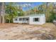 Charming single story home with white siding, green shutters, and a welcoming front porch at 3934 North Fraser St., Georgetown, SC 29440