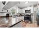 Well-lit kitchen featuring white cabinetry, stainless steel appliances, and a laminate countertop at 3934 North Fraser St., Georgetown, SC 29440