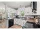 Efficient kitchen with white cabinets, stainless steel appliances, and functional layout at 3934 North Fraser St., Georgetown, SC 29440