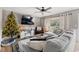 Cozy living room with comfortable seating, a large window, and a decorative Christmas tree at 3934 North Fraser St., Georgetown, SC 29440