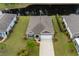 Aerial view of a charming home with well-maintained landscaping and a nearby pond at 40 Parkside Dr., Pawleys Island, SC 29585