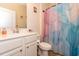 A bathroom featuring a single sink vanity with modern fixtures and a colorful shower curtain at 40 Parkside Dr., Pawleys Island, SC 29585