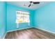 Bedroom features wood-look floors, a ceiling fan, and a large window at 40 Parkside Dr., Pawleys Island, SC 29585