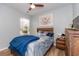 Comfortable bedroom with modern ceiling fan, wood bed frame, and cozy decor at 40 Parkside Dr., Pawleys Island, SC 29585