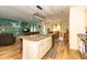 Open-concept kitchen with an island bar overlooking the dining and living areas, promoting seamless entertaining at 40 Parkside Dr., Pawleys Island, SC 29585