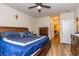 Comfortable main bedroom with wood flooring, neutral walls, and an adjoining ensuite bathroom and closet at 40 Parkside Dr., Pawleys Island, SC 29585