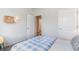 Comfortable bedroom with a blue bedspread, and a peek into the hallway at 400 Rookroost Circle, Conway, SC 29526