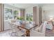 Inviting dining area with large windows, a wooden table, and comfortable seating at 400 Rookroost Circle, Conway, SC 29526