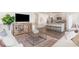 Cozy living room featuring hardwood floors, a modern TV, and a stylish coffee table at 400 Rookroost Circle, Conway, SC 29526