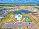 Aerial view of a community with a pool, tennis courts and scenic ponds at 4009 Alvina Way, Myrtle Beach, SC 29579