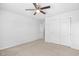 Bedroom featuring carpet, a ceiling fan, and a closet with sliding doors at 4009 Alvina Way, Myrtle Beach, SC 29579