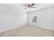 Bright bedroom featuring a window view, a ceiling fan, and neutral carpet at 4009 Alvina Way, Myrtle Beach, SC 29579