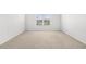 Bedroom featuring neutral carpet, white walls, and a window with blinds at 4009 Alvina Way, Myrtle Beach, SC 29579