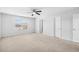Spacious bedroom featuring neutral carpet, a ceiling fan, and a bright window at 4009 Alvina Way, Myrtle Beach, SC 29579