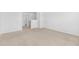 A carpeted room with neutral walls, leading to an upstairs landing at 4009 Alvina Way, Myrtle Beach, SC 29579