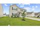 Charming two-story home with a well-manicured lawn and a driveway at 4009 Alvina Way, Myrtle Beach, SC 29579