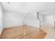 Open-concept living area featuring hardwood floors, staircase and neutral color scheme offering a clean and bright space at 4009 Alvina Way, Myrtle Beach, SC 29579