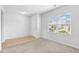 Bright living room features plush carpeting, a large window, and neutral paint, offering a welcoming space at 4009 Alvina Way, Myrtle Beach, SC 29579