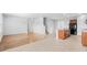 Open-concept living space with hardwood floors, adjacent kitchen, and staircase leading to upper level at 4009 Alvina Way, Myrtle Beach, SC 29579