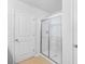 Modern bathroom with a clean shower stall, white door and tiled floor at 4009 Alvina Way, Myrtle Beach, SC 29579