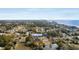 An aerial shot showcases a charming neighborhood, the ocean, and the location of 409 14th Ave S highlighted at 409 14Th Ave. S, North Myrtle Beach, SC 29582