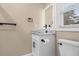 Updated half-bath featuring vessel sink, modern faucet, and matte-black hardware at 409 14Th Ave. S, North Myrtle Beach, SC 29582