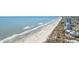Picturesque beach scene with calm waves and a lively beachfront community; perfect for coastal living at 409 14Th Ave. S, North Myrtle Beach, SC 29582