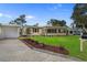 Charming single-story home featuring a manicured front yard and attached garage at 409 14Th Ave. S, North Myrtle Beach, SC 29582