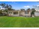 Charming home featuring a sun room, a manicured lawn and tasteful landscaping at 409 14Th Ave. S, North Myrtle Beach, SC 29582