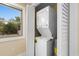 Efficient laundry area featuring a stacked washer and dryer unit at 409 14Th Ave. S, North Myrtle Beach, SC 29582