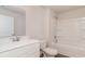 Clean bathroom boasts a white vanity, toilet, and shower-tub combination with a shower head at 411 Acosta Circle, Conway, SC 29527