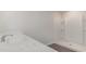 Bathroom with white marbled countertop, chrome faucet, and stand-up shower at 411 Acosta Circle, Conway, SC 29527