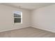 Well-lit bedroom with neutral walls and soft carpeting offering a comfortable living space at 411 Acosta Circle, Conway, SC 29527