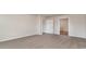 Spacious carpeted bedroom with adjacent entryways and neutral walls at 411 Acosta Circle, Conway, SC 29527