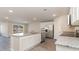 Well-equipped kitchen with stainless steel appliances, granite counters, island, and ample white cabinetry at 411 Acosta Circle, Conway, SC 29527